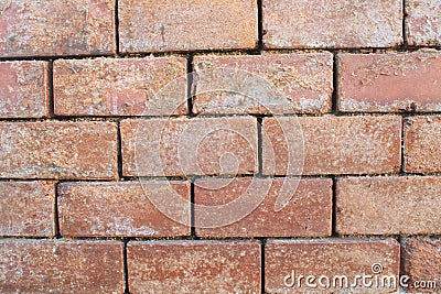 Red clay brick wall old eroded Stock Photo