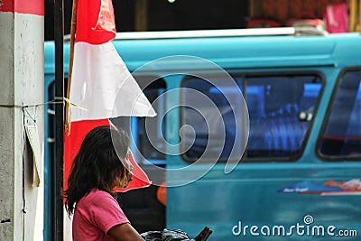 red clothing person blue vehicle child girl pink spring costume woman face of asian homeless was standing on the street Editorial Stock Photo