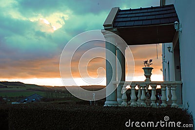 Entrance of an old landhouse in Tournehem-sur-la-Hem, France with sunset in the background Stock Photo