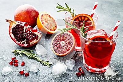 Red cocktail with blood orange and pomegranate. Refreshing summer drink. Holiday aperitif for Christmas party. Stock Photo