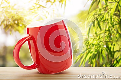 Red coffee cup empty front porch the morning Stock Photo