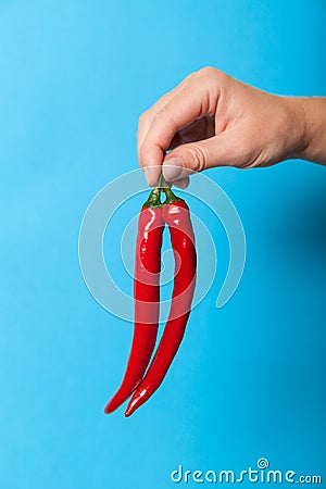 Red color chilli pepper in hand, heat asian food Stock Photo