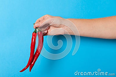 Red color chilli pepper in hand, heat asian food Stock Photo