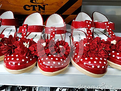 Red Color Girl Baby Shoes in a Shelf for Sale in a Mall. Interior design of a Foot Wear Department in Vishal Mall, Laggere Editorial Stock Photo