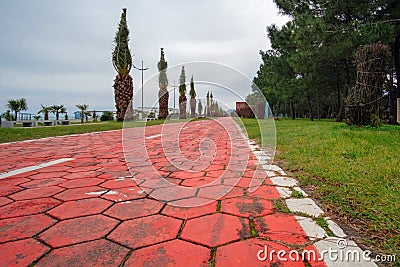 Red color pavement at seaside park Stock Photo