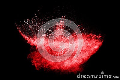 Red color powder explosion on black background. Mauve red color cloud. Stock Photo