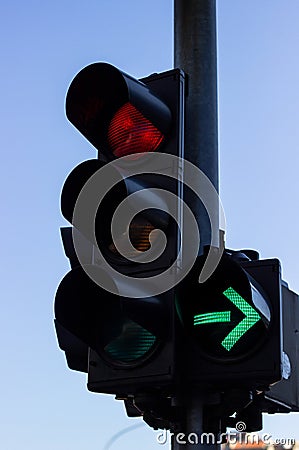 Red color and right Green arrow on the traffic light Stock Photo