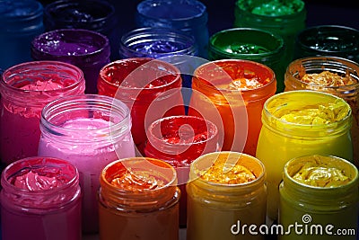 red color of screen printing ink for print on tee shirts and fabric. Stock Photo