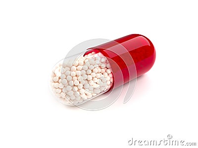 Red colored pill on white background Stock Photo