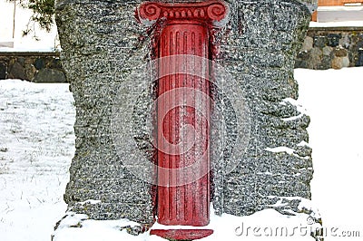 Red Column Sculpture on the Snow Stock Photo
