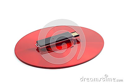 Red compact disc and black removable USB drive Stock Photo