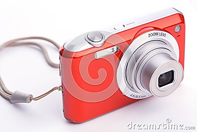 Red compact zoom digital camera over white Stock Photo