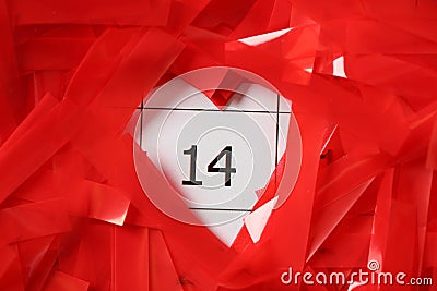 Red confetti on calendar with number 14, closeup. Valentine`s Day celebration Stock Photo
