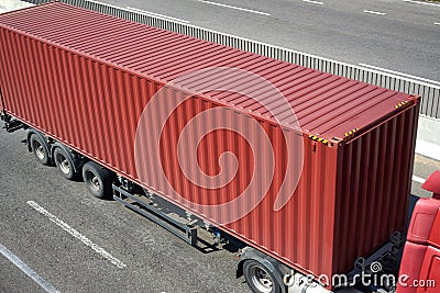 Red container and truck on road top view, cargo transportation and shipping concept Stock Photo