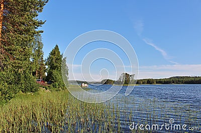 Red cottages by a lake in Norrbotten Stock Photo