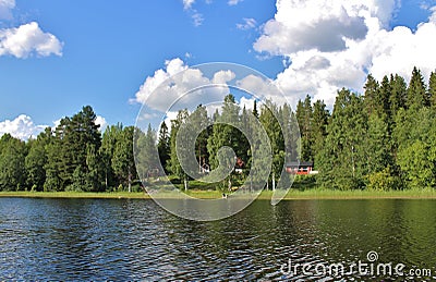 Red cottages by a lake in Norrbotten Stock Photo