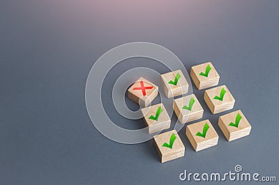 Red cross disturbs order of block structure. Violation of terms of contract, termination of deal. Artificial bureaucratic Stock Photo