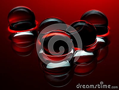 Red crystal balls in the water - abstract background Stock Photo