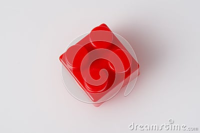 Red cube block constructor on a white background with copy space. Construction idea concept Stock Photo