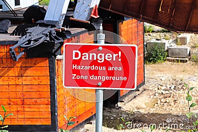 A red danger hazardous area sign in english and french Stock Photo