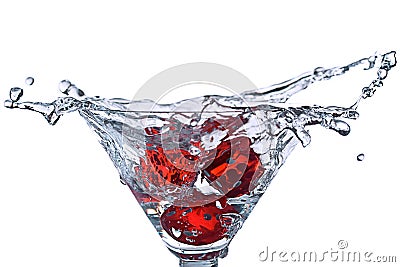 Red Dice falling in the martini glass Stock Photo