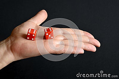 Red dices on the male palm Stock Photo