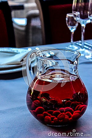 Red dogwood compote in a transparent decanter Stock Photo