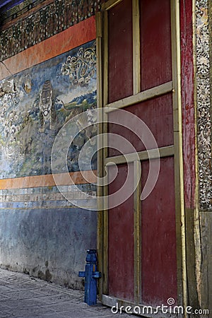 A red doorway brightens the Pelkor Chode Monastery in Gyantse Stock Photo