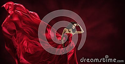 Red Dress, Woman in Flying Fashion Silk Fabric Clothes Model Stock Photo