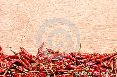 Red dried chili pepper on wooden background Stock Photo