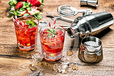 Red drink with ice. Cocktail making bar tools Stock Photo