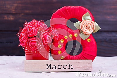 Red eight, flowers, word March Stock Photo