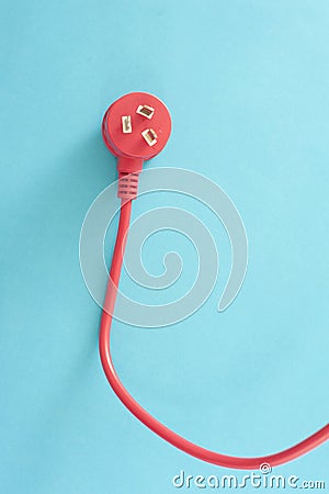 Red electrical lead with integrated plug Stock Photo