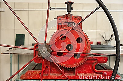 Red etching press for printmaking in etching studio Stock Photo