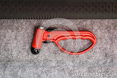 Red evacuation emergency break glass hammer tool on public trans Stock Photo