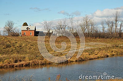 The red farmhouse in fall Stock Photo