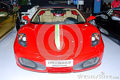 Red Ferrari sports cars in the auto show Editorial Stock Photo