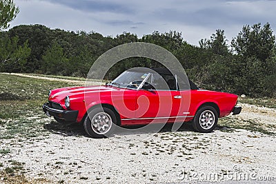 Red Fiat 124 spider, classic Italian sport car from 70s and 80s Editorial Stock Photo