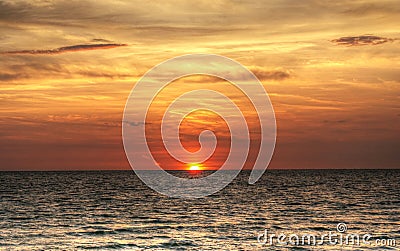 Red, fiery sunset over the ocean Stock Photo