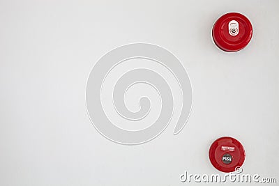 Red fire alarm bell on white wall background. Stock Photo