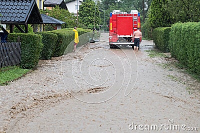 Fire department rushes to rescue when floods hit village in Europe after heavy rain Editorial Stock Photo