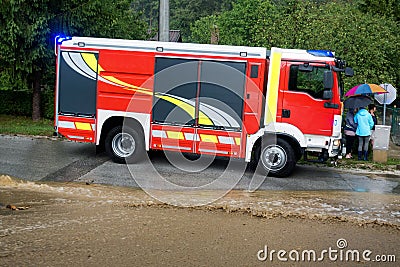 Fire department rushes to rescue when floods hit village in Europe after heavy rain Editorial Stock Photo