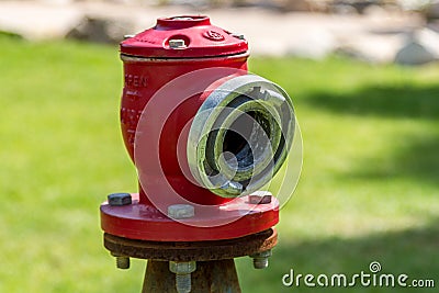 Red fire hose connector Stock Photo