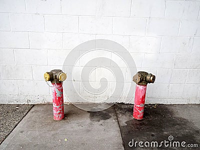 A red fire hydrant, faucet or fire hydrant, a water intake to provide a flow rate in the event of a fire. Water can be obtained fr Stock Photo