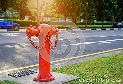 Red fire hydrant water pipe near the road. Stock Photo