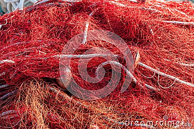 Red fishing nets with floats and ropes. Still-life shot, perfect image for fishing, aquaculture, intensive fishing and Stock Photo