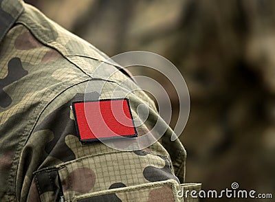 Red flag on military uniform. Red flag one of the first anarchist symbols. Anarchism Red flag Stock Photo