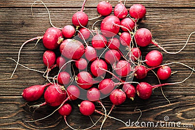 red fresh radish top view on a background of wooden boards. Stock Photo