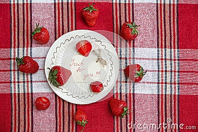 Red Fresh Strawberries on the Ceramic White Plate on the Check T Stock Photo