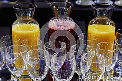 Red fruits and orange juice and crystal glasses Stock Photo